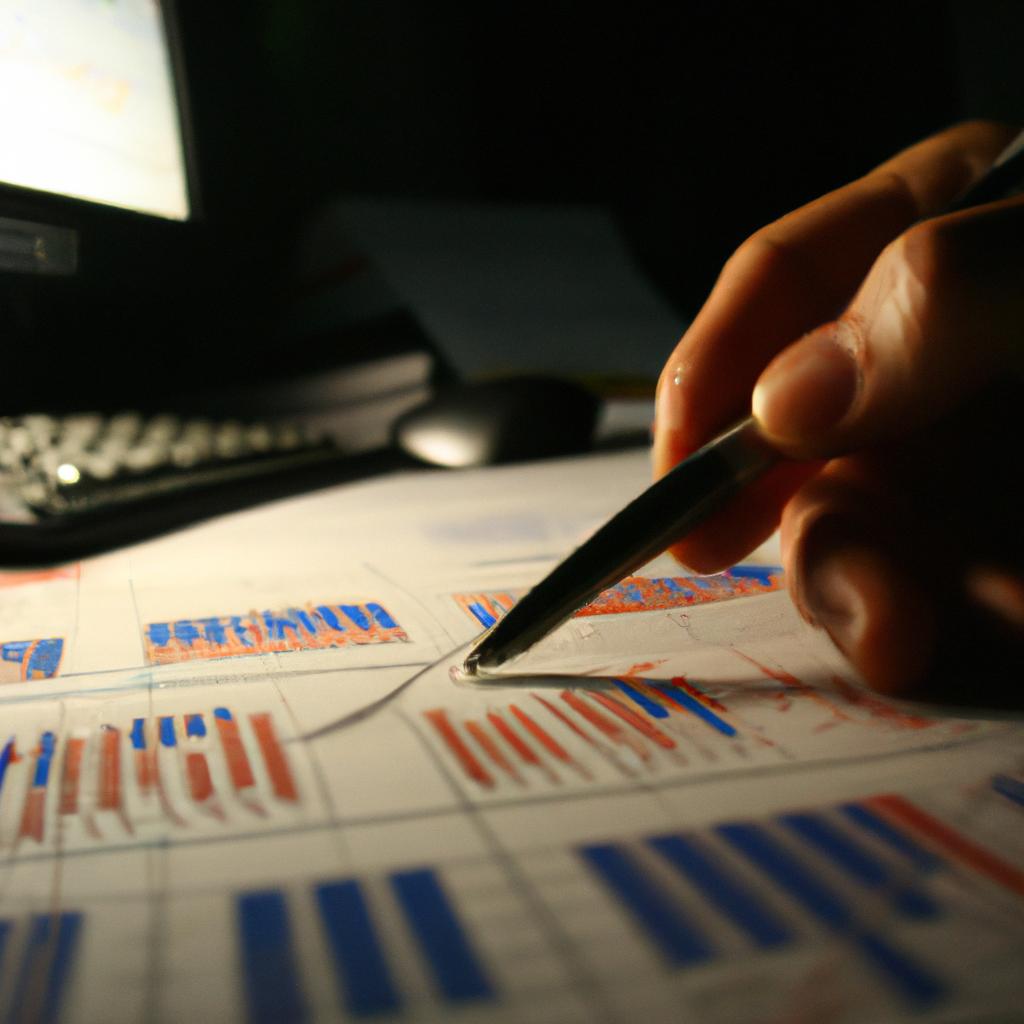Person analyzing financial data, night