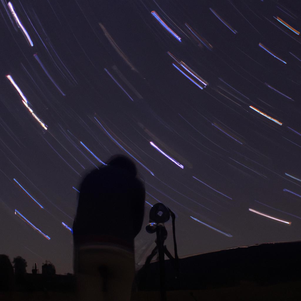 Person photographing star trails at night