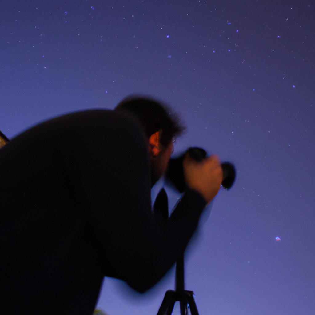 Person photographing stars at night