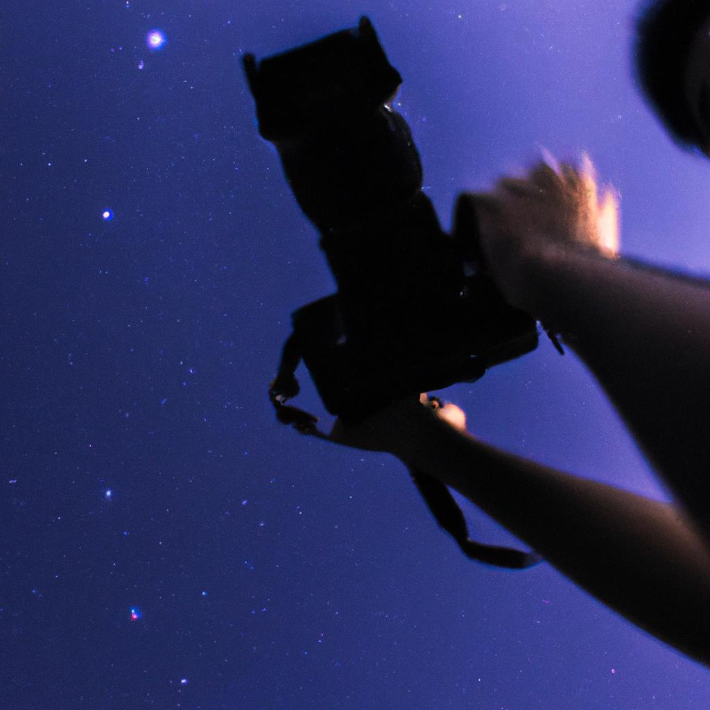 Person holding camera, capturing stars