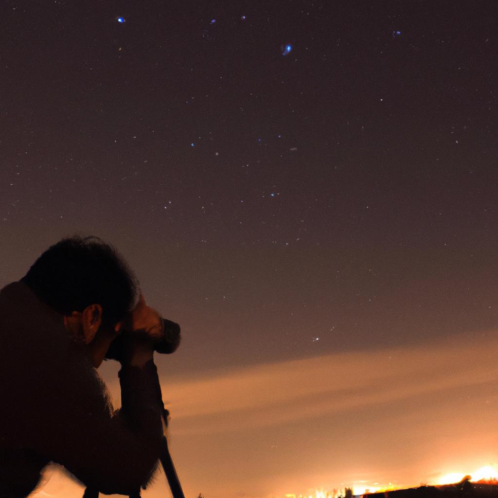 Person photographing the night sky
