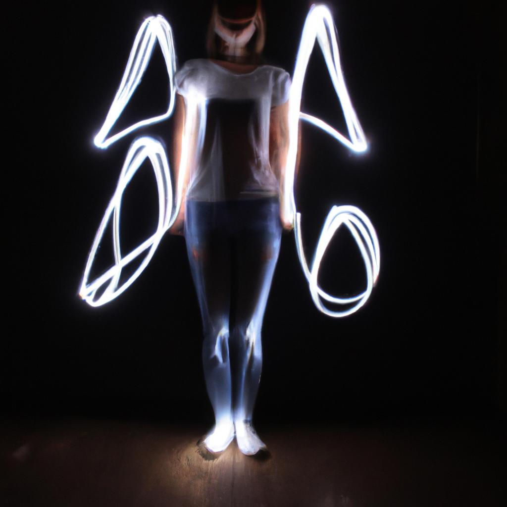 Person painting with flashlights