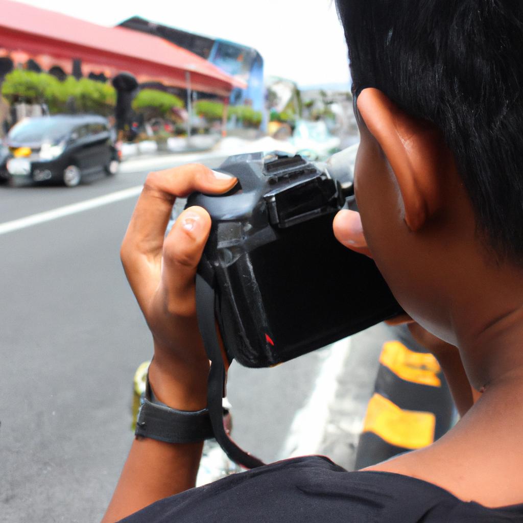 Person capturing traffic with camera
